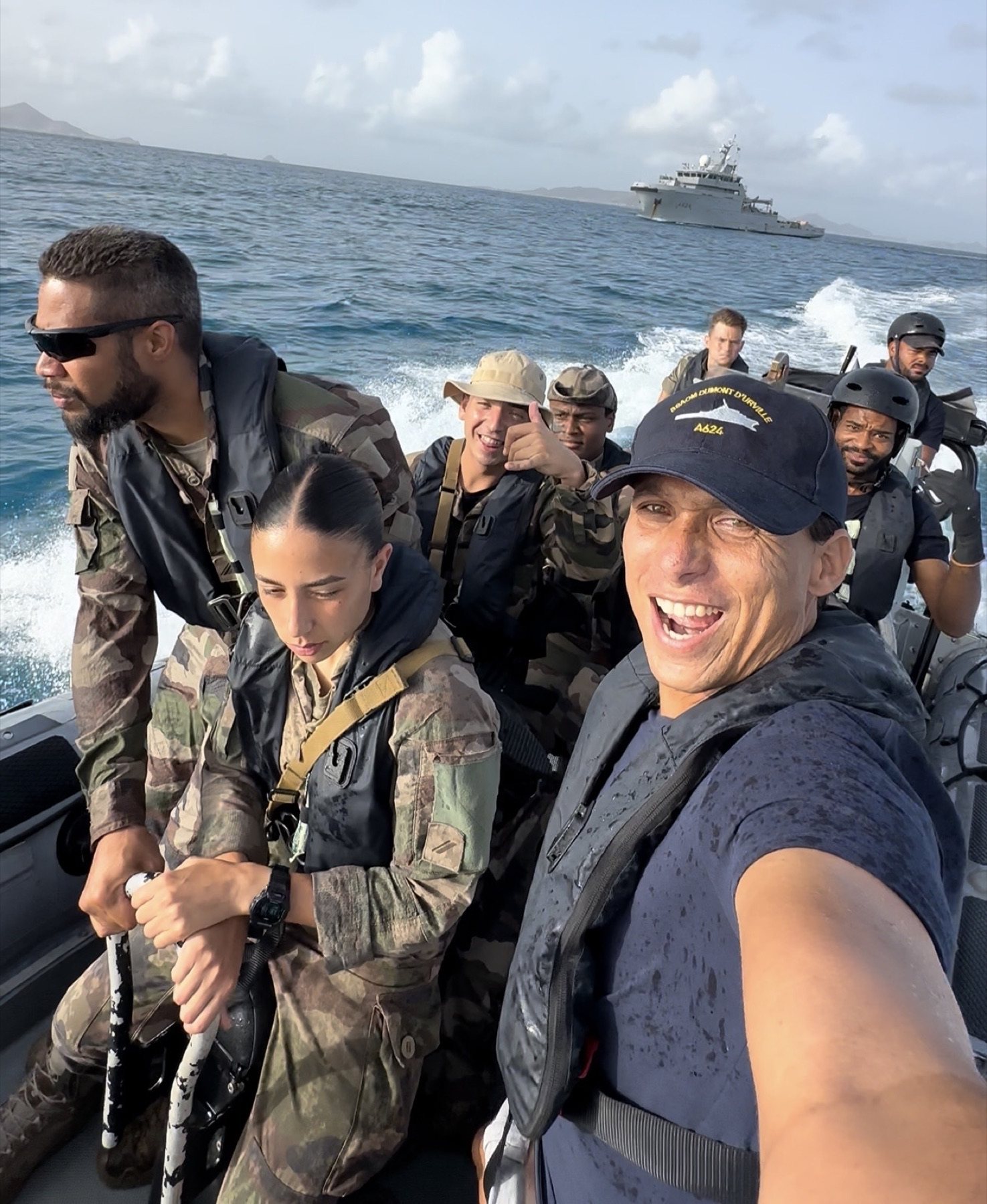 Jeremie travelling by boat with French Navy support during the Union Island relief response